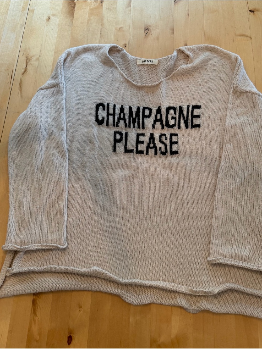 Miracle Light Beige Sweater with Black 'CHAMPAGNE PLEASE' Text